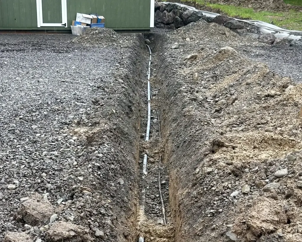 Home 26 Professional drainage repair for failing systems being integrated with a new septic system installation to restore proper waste management and soil absorption.