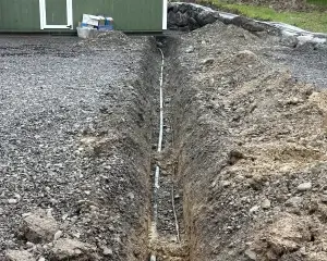Professional drainage repair for failing systems being integrated with a new septic system installation to restore proper waste management and soil absorption.