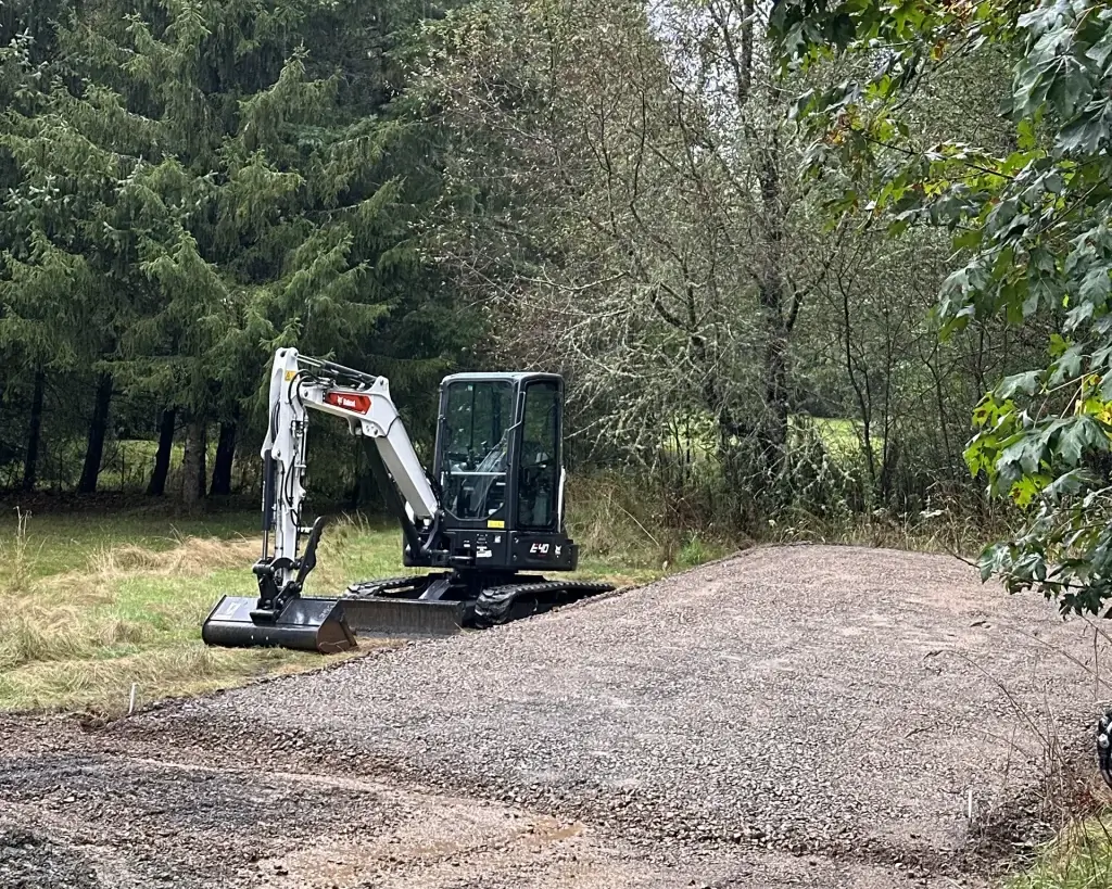 Home 10 Excavation and grading for gravel pad base