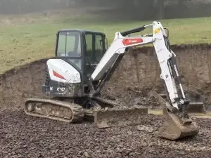 A professional excavation services contractor utilizing heavy machinery for expert excavation to clear land, stabilize soil, and prepare a solid foundation for construction.